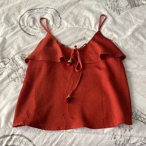 Brick red top; adjustable shoulder straps.